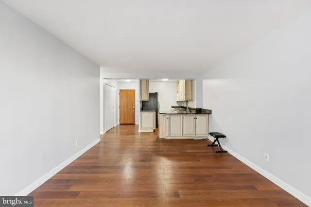a view of kitchen and wooden floor