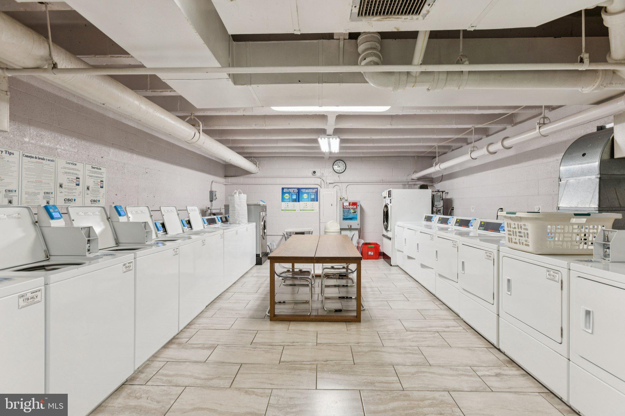 730 24th Street Northwest, Unit 321 Washington, DC 20037 - Photo 15 of 20 a kitchen with stainless steel appliances kitchen island granite countertop a sink and white cabinets