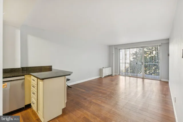 a view of a kitchen with wooden floor