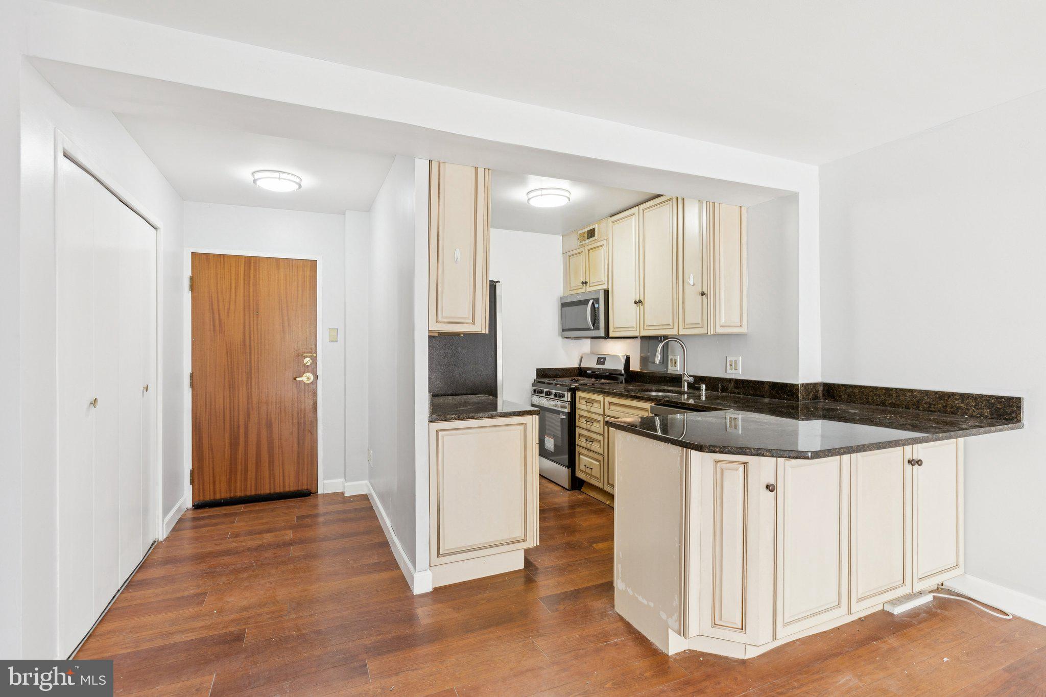 730 24th Street Northwest, Unit 321 Washington, DC 20037 - Photo 7 of 20 a kitchen with a sink and white cabinets