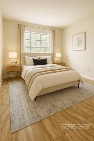 a spacious bedroom with a bed and a couch