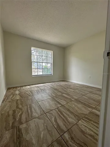an empty room with wooden floor