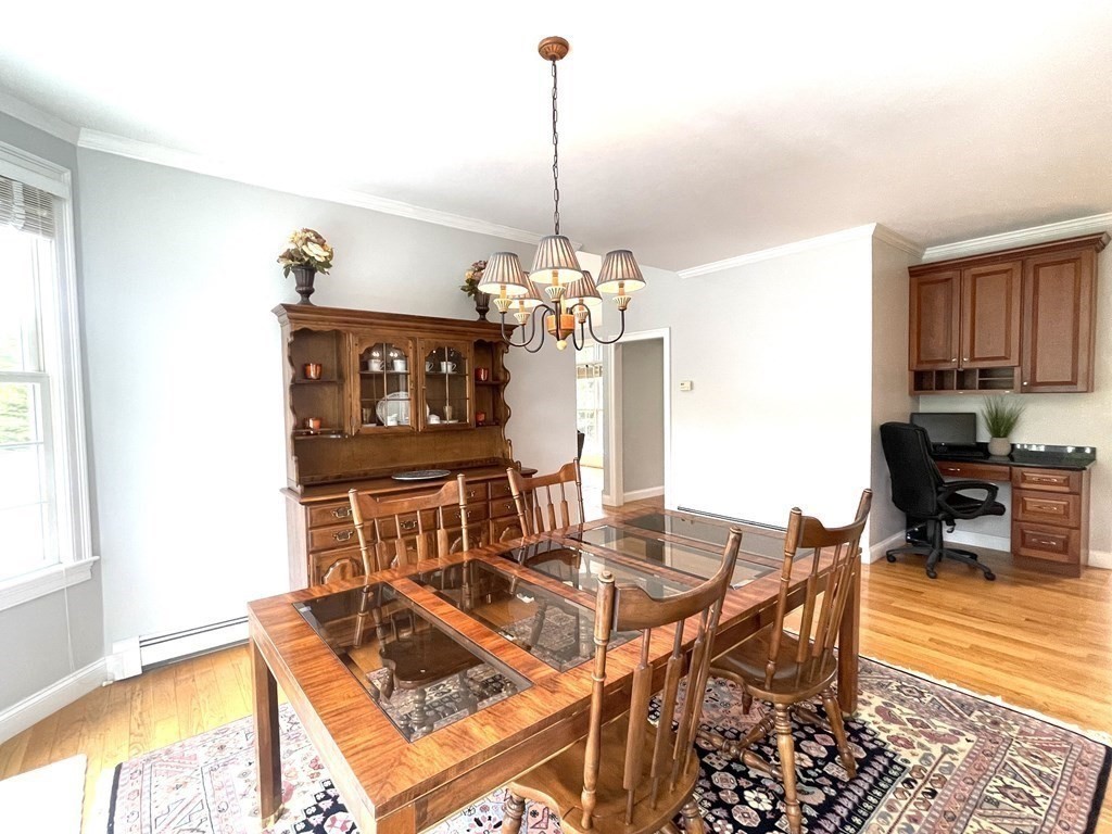 148 Hillcrest Road Marshfield, MA 02050 - Photo 11 of 42 a view of a dining room with furniture window and outside view