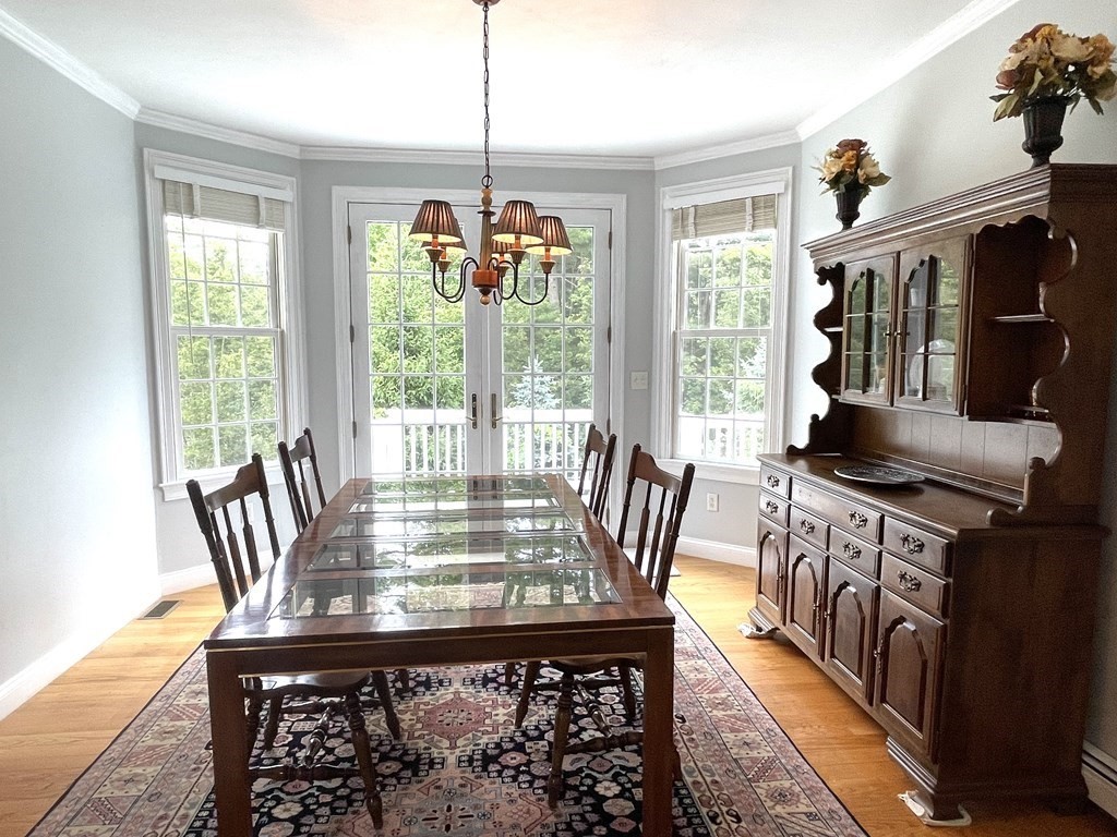 148 Hillcrest Road Marshfield, MA 02050 - Photo 12 of 42 a view of a dining room with furniture window and outside view
