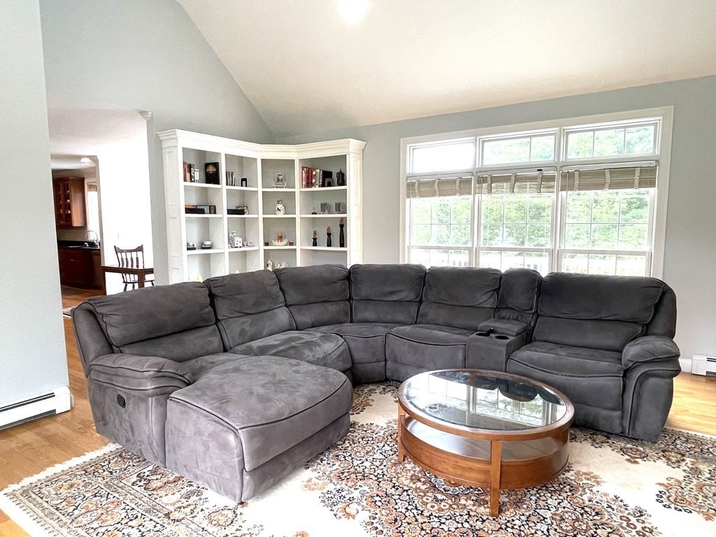 148 Hillcrest Road Marshfield, MA 02050 - Photo 14 of 42 a living room with furniture a rug and a large window