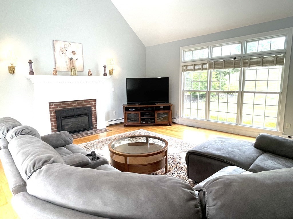 148 Hillcrest Road Marshfield, MA 02050 - Photo 15 of 42 a living room with furniture and a flat screen tv