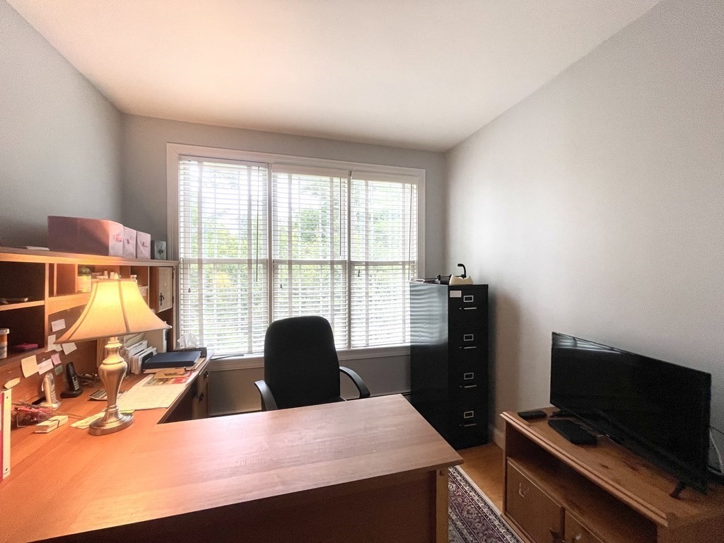 148 Hillcrest Road Marshfield, MA 02050 - Photo 16 of 42 a living room with furniture and a flat screen tv
