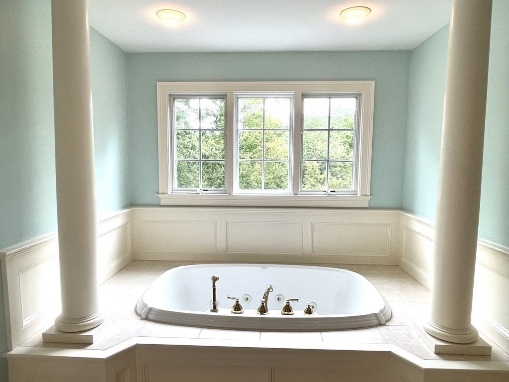 148 Hillcrest Road Marshfield, MA 02050 - Photo 22 of 42 a bath tub sitting in a bathroom next to a window