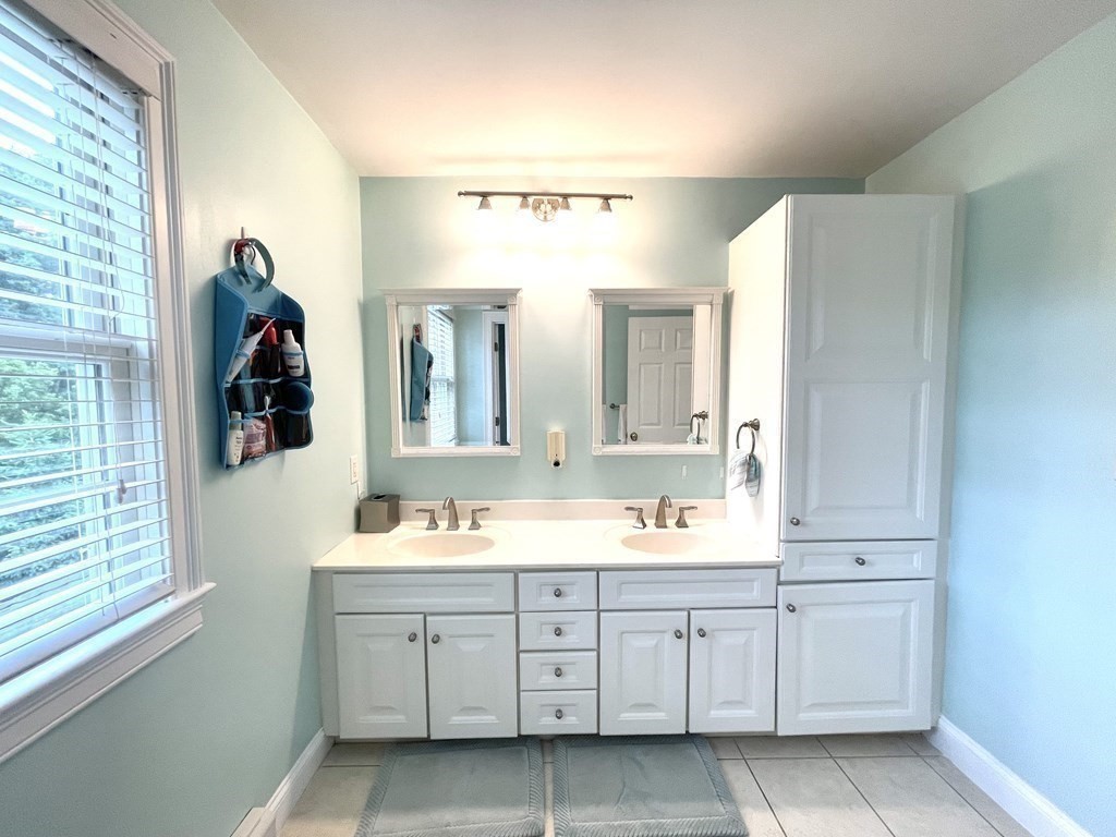 148 Hillcrest Road Marshfield, MA 02050 - Photo 28 of 42 a en suite bathroom with double sink and a large mirror