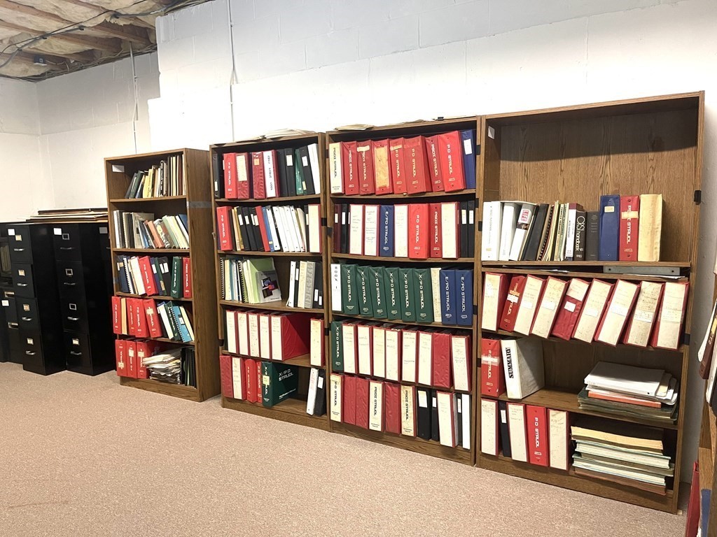 148 Hillcrest Road Marshfield, MA 02050 - Photo 33 of 42 a book shelf with living room in it