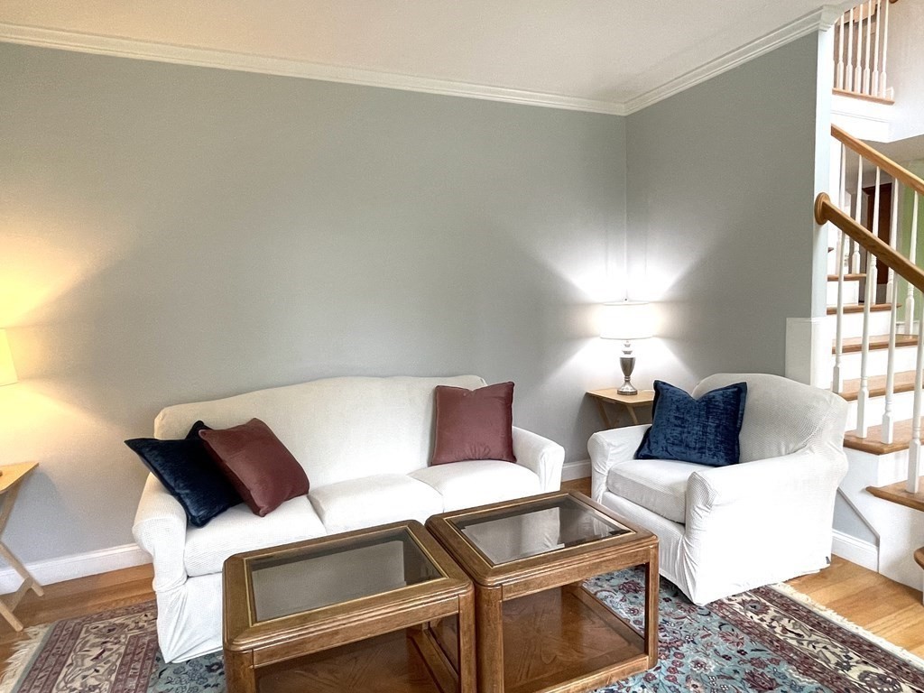 148 Hillcrest Road Marshfield, MA 02050 - Photo 7 of 42 a living room with a couch and a rug