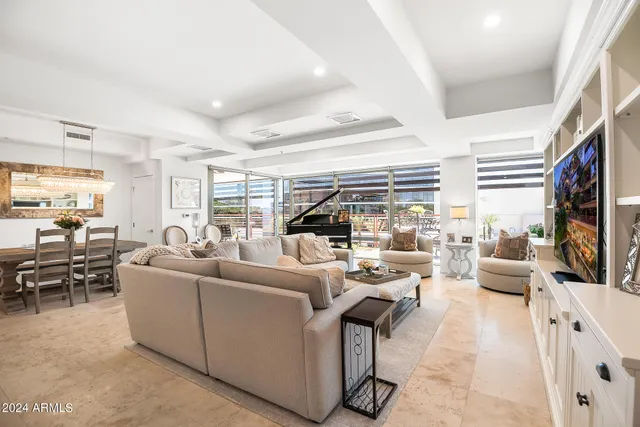 a living room with fireplace furniture and a flat screen tv