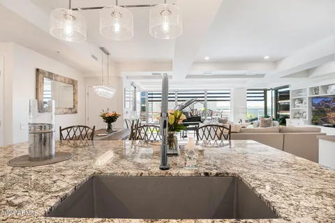 a kitchen with refrigerator and cabinets