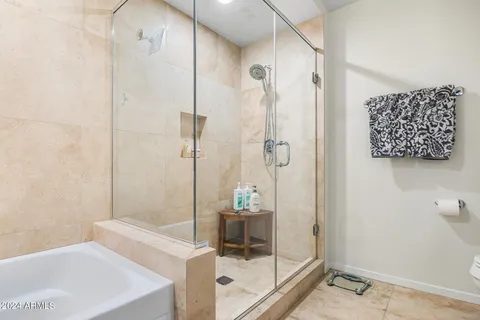a bathroom with a shower and a sink