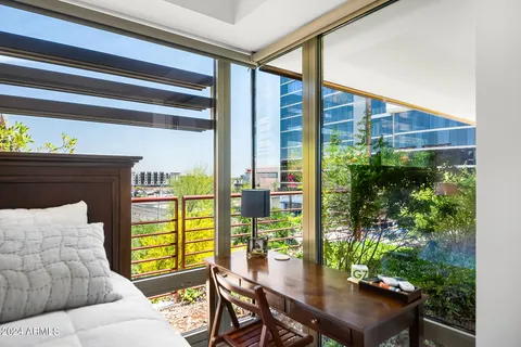 a swimming pool with outdoor seating and yard