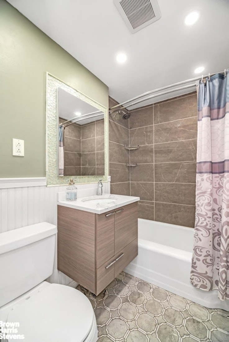 305 East 40th Street, Unit 4F Manhattan, NY 10016 - Photo 5 of 9 a bathroom with a sink a toilet and bathtub