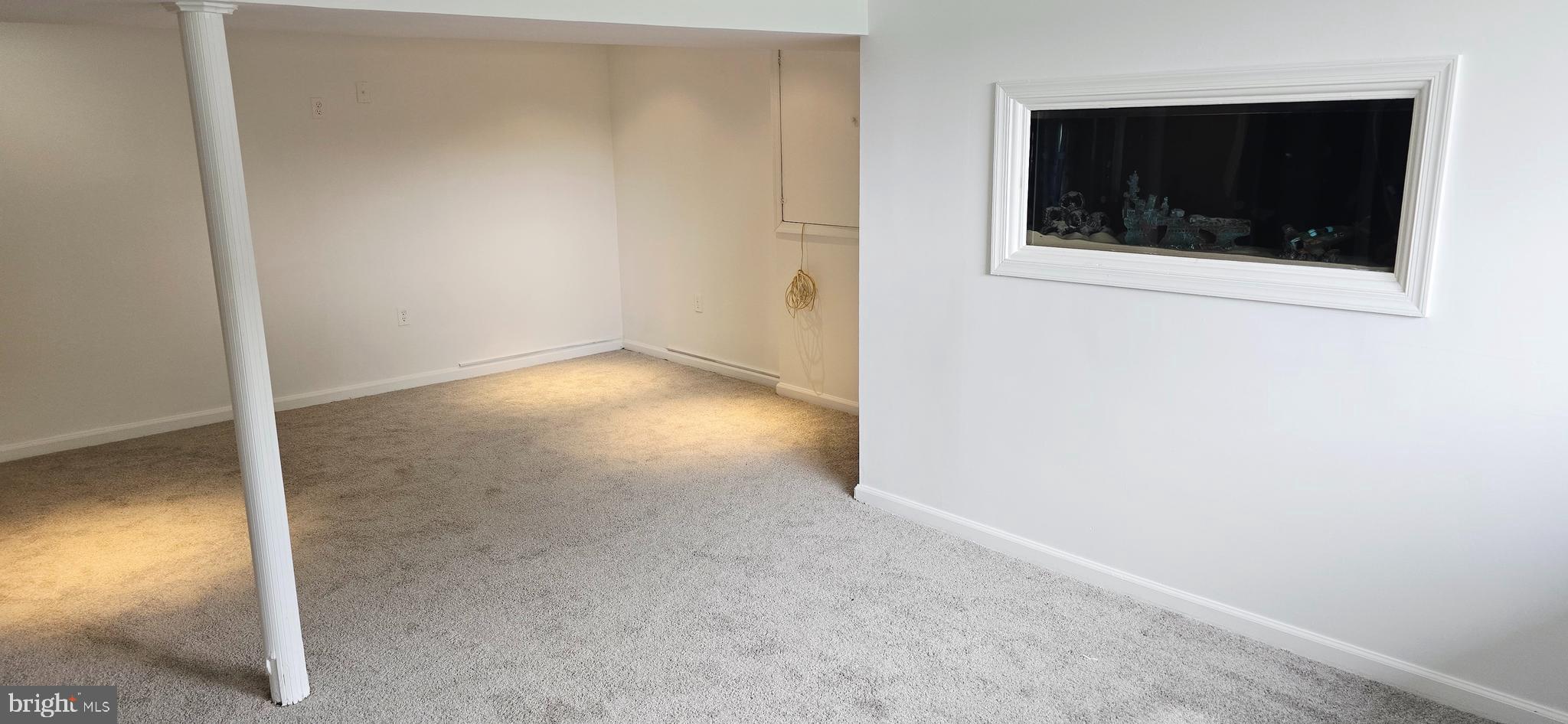 1700 Jarvis Avenue Oxon Hill, MD 20745 - Photo 13 of 15 a view of an empty room with wooden floor and a window