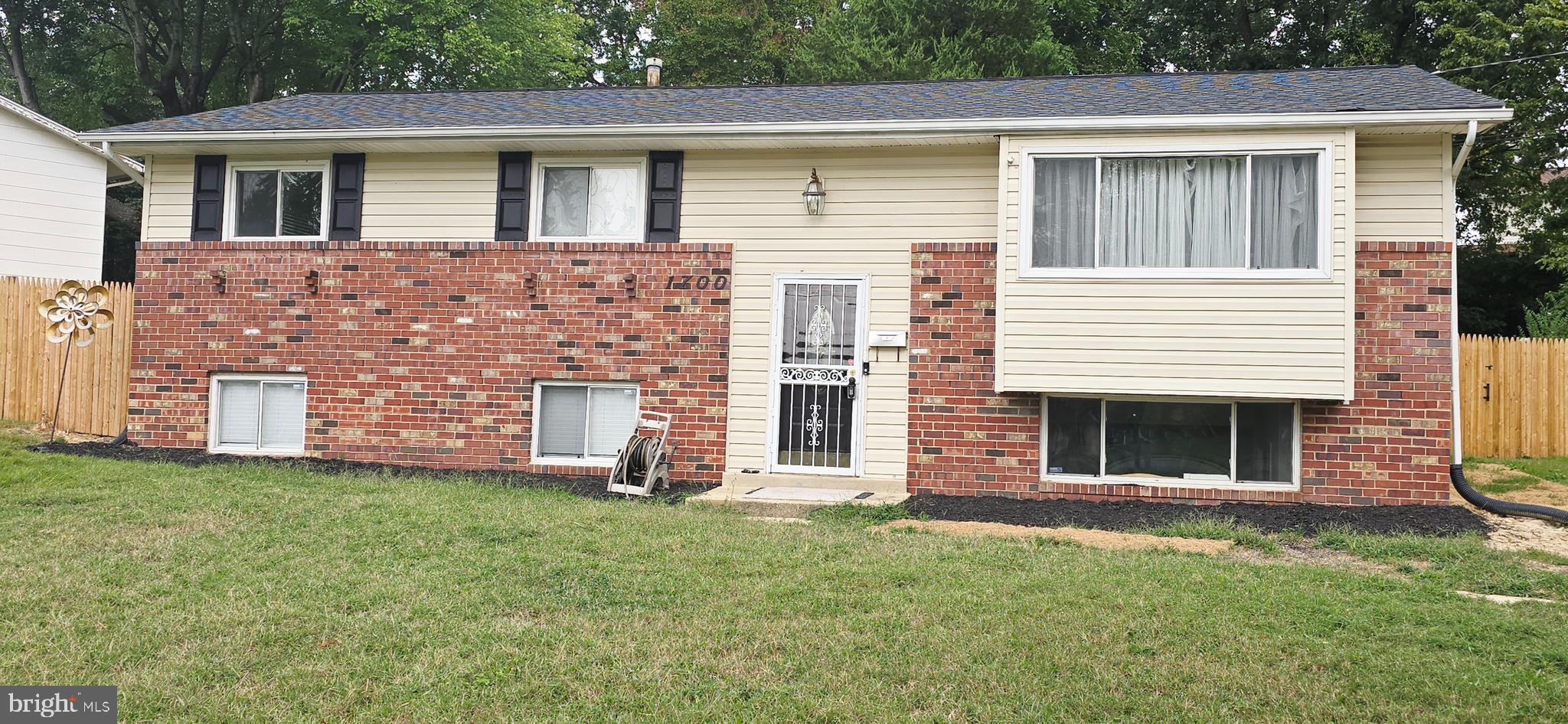 1700 Jarvis Avenue Oxon Hill, MD 20745 - Photo 15 of 15 a front view of a house with a yard