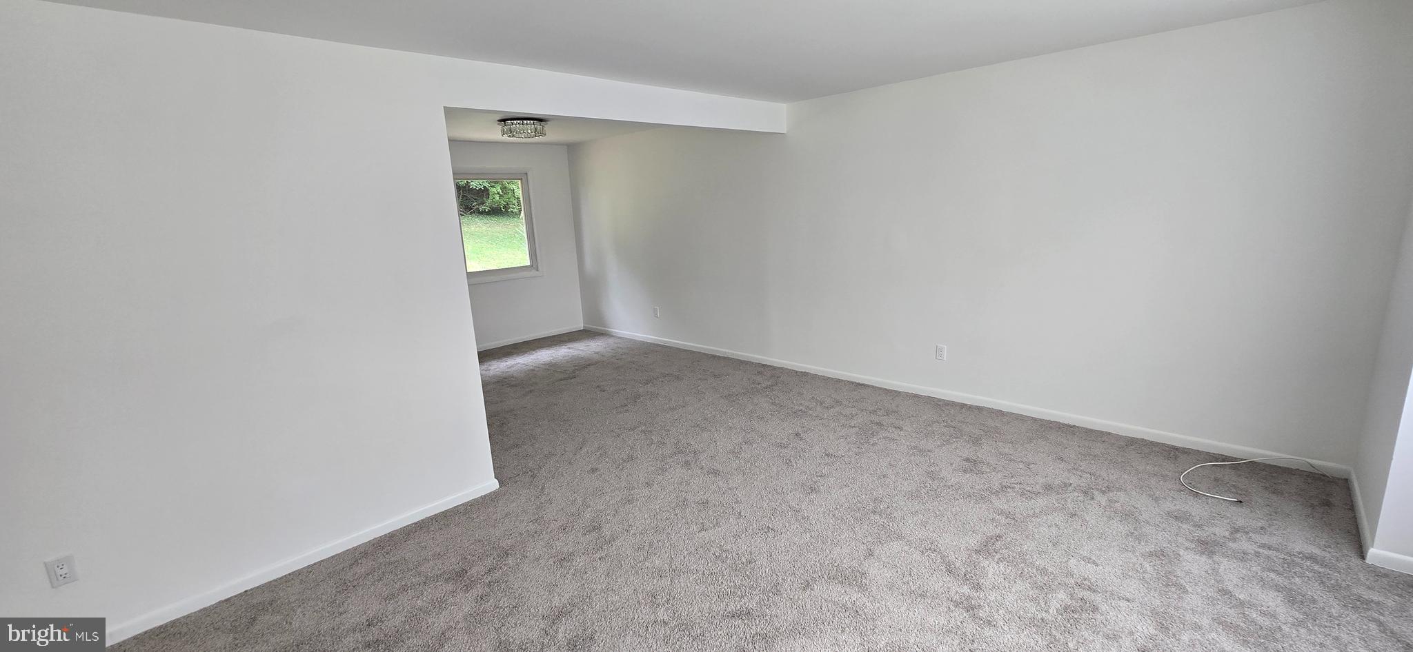 1700 Jarvis Avenue Oxon Hill, MD 20745 - Photo 4 of 15 an empty room with windows and closet