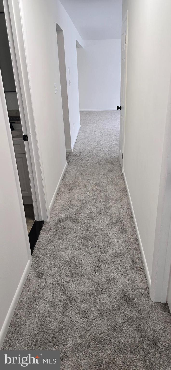 1700 Jarvis Avenue Oxon Hill, MD 20745 - Photo 8 of 15 an entryway door with a hallway in the house