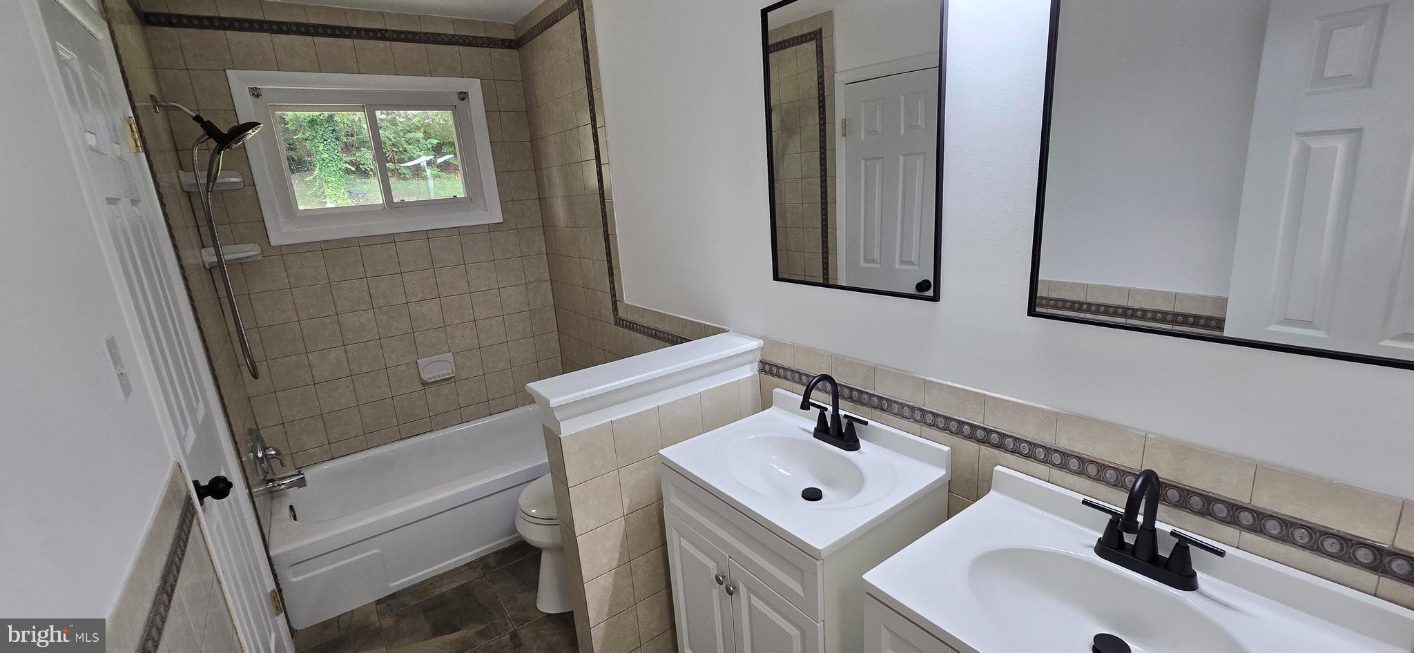 1700 Jarvis Avenue Oxon Hill, MD 20745 - Photo 10 of 15 a bathroom with a sink a mirror and shower