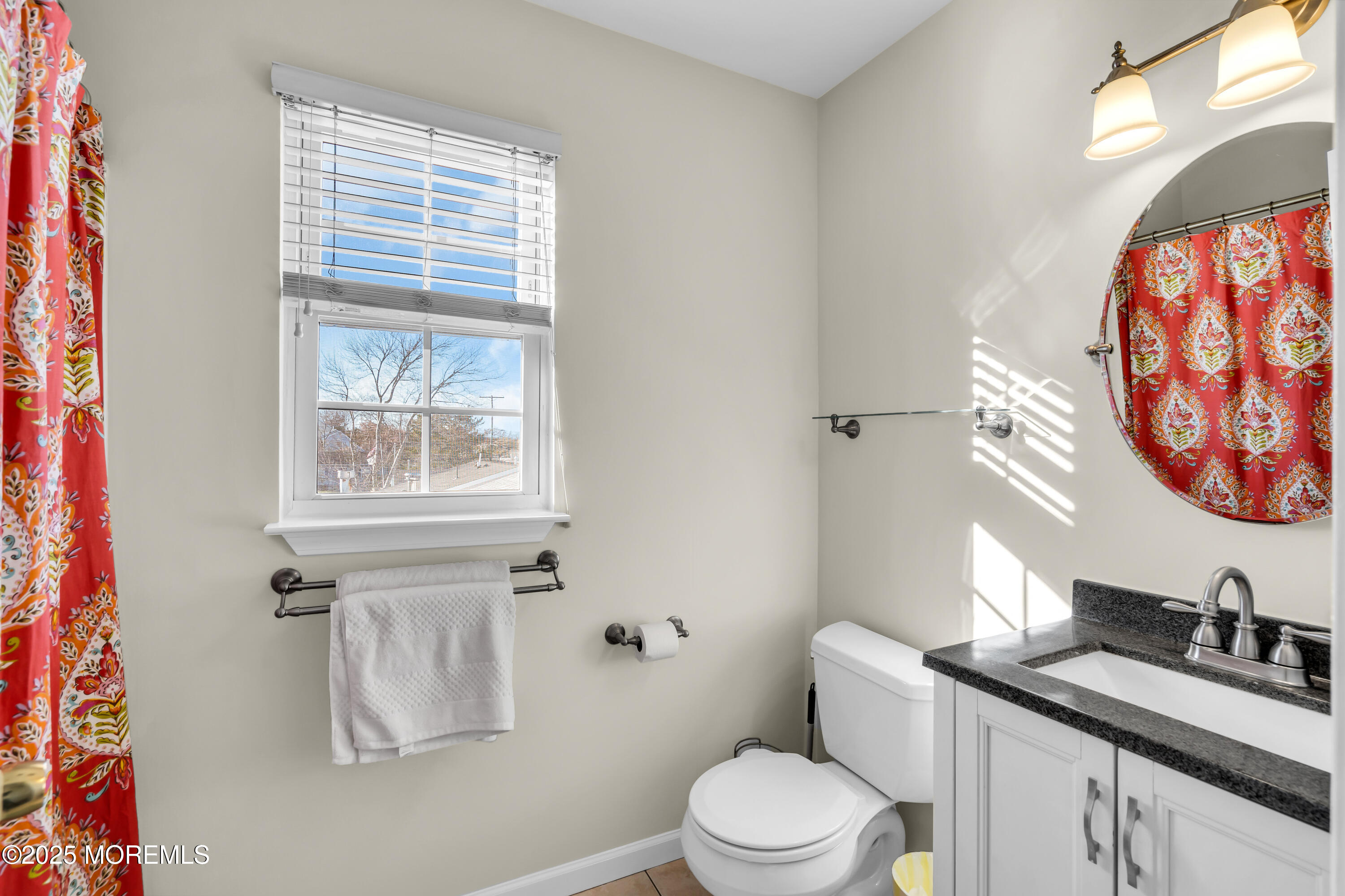 1007 Inland Road Forked River, NJ 08731 - Photo 13 of 27 a bathroom with a granite countertop sink mirror vanity and toilet