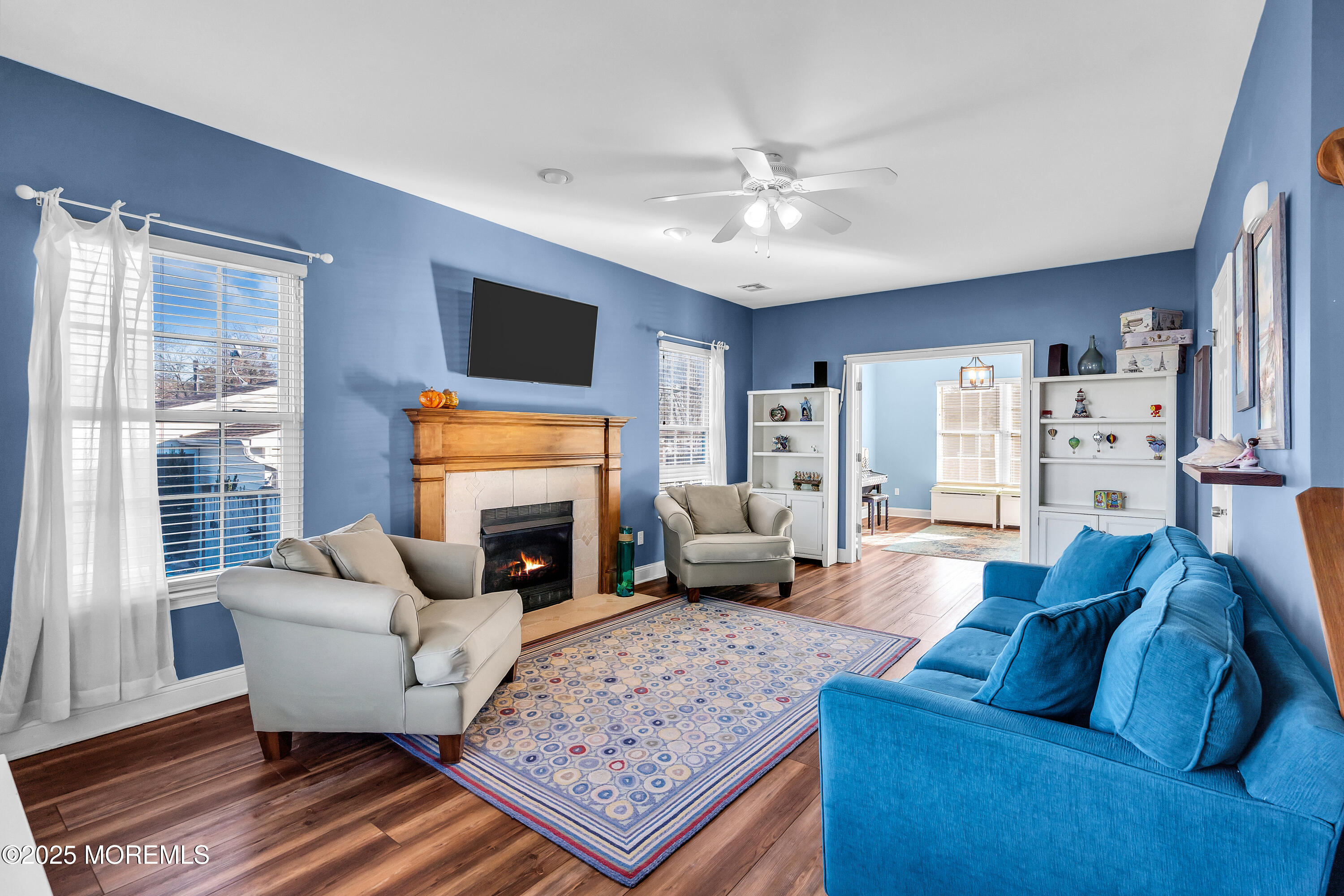 1007 Inland Road Forked River, NJ 08731 - Photo 3 of 27 a living room with furniture or couch and a fireplace