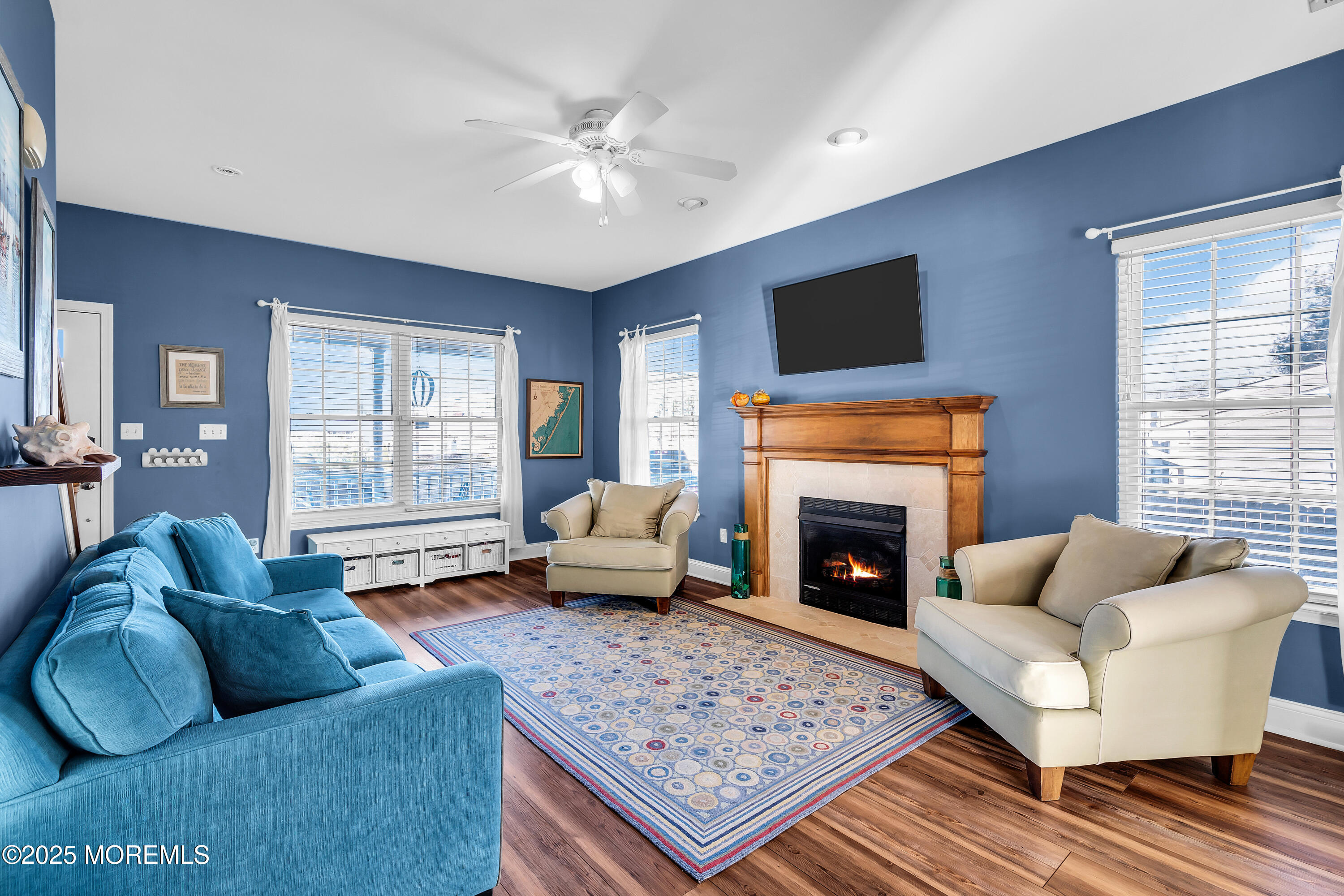 1007 Inland Road Forked River, NJ 08731 - Photo 4 of 27 a living room with furniture a flat screen tv and a fireplace