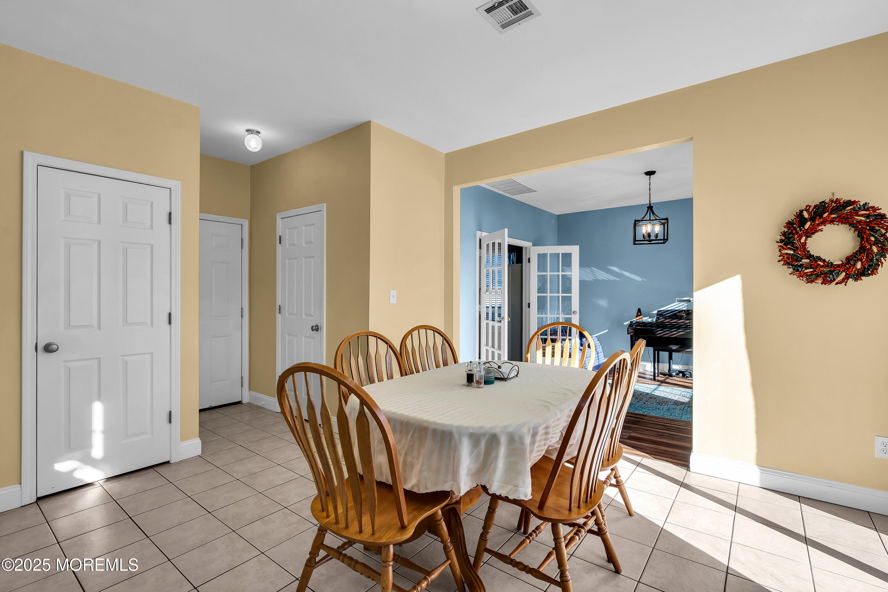 1007 Inland Road Forked River, NJ 08731 - Photo 10 of 27 a view of a a dining room with furniture window and wooden floor