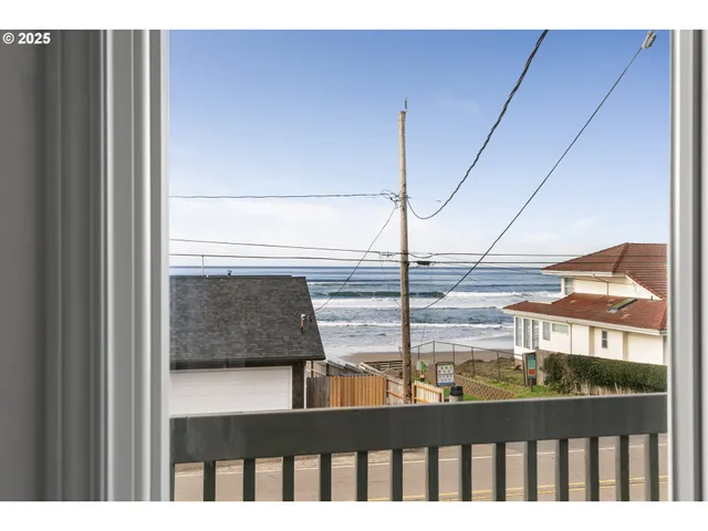 a view of a balcony with an ocean view