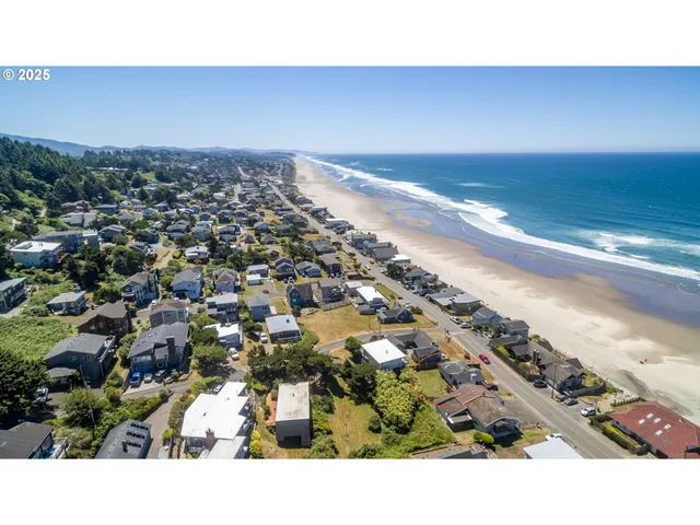 a view of an ocean beach and mountain