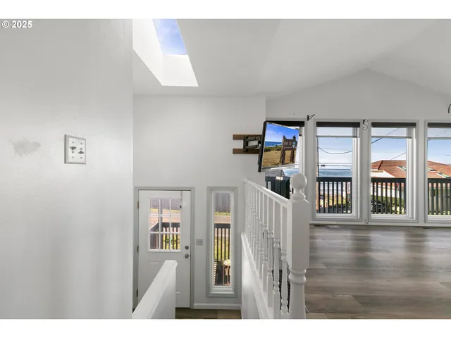 a picture of a living room with a wooden floor