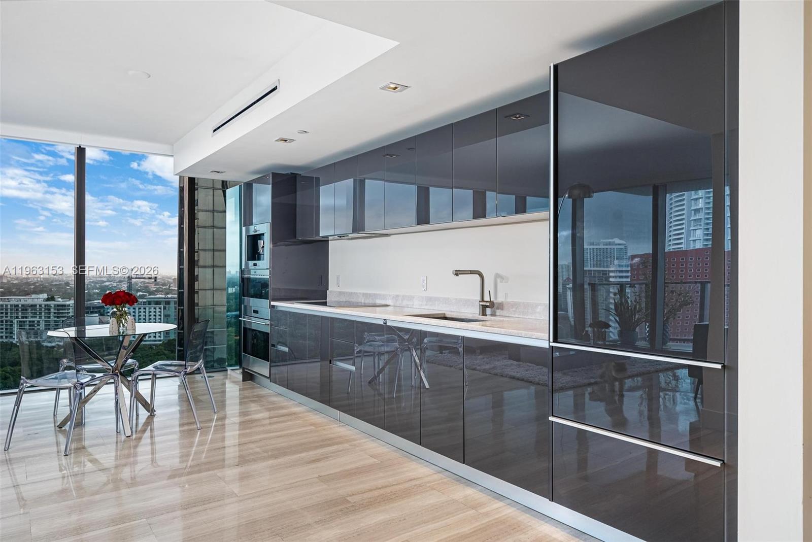 1451 Brickell Avenue, Unit 2204 Miami, FL 33131 - Photo 8 of 29 a spacious bathroom with a glass shower door and sink