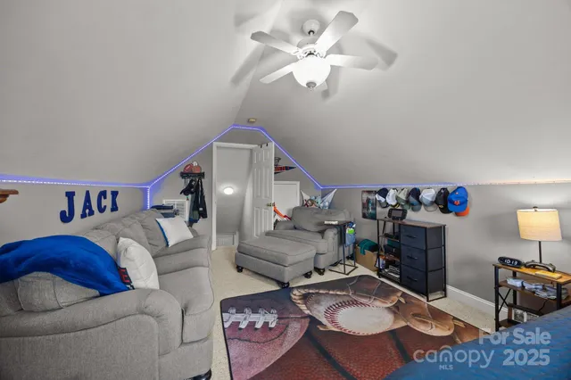 a living room with furniture a rug and a chandelier