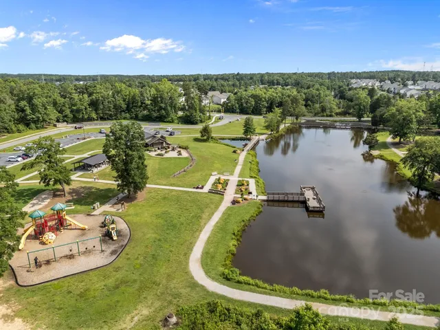 a view of a swimming pool with a yard