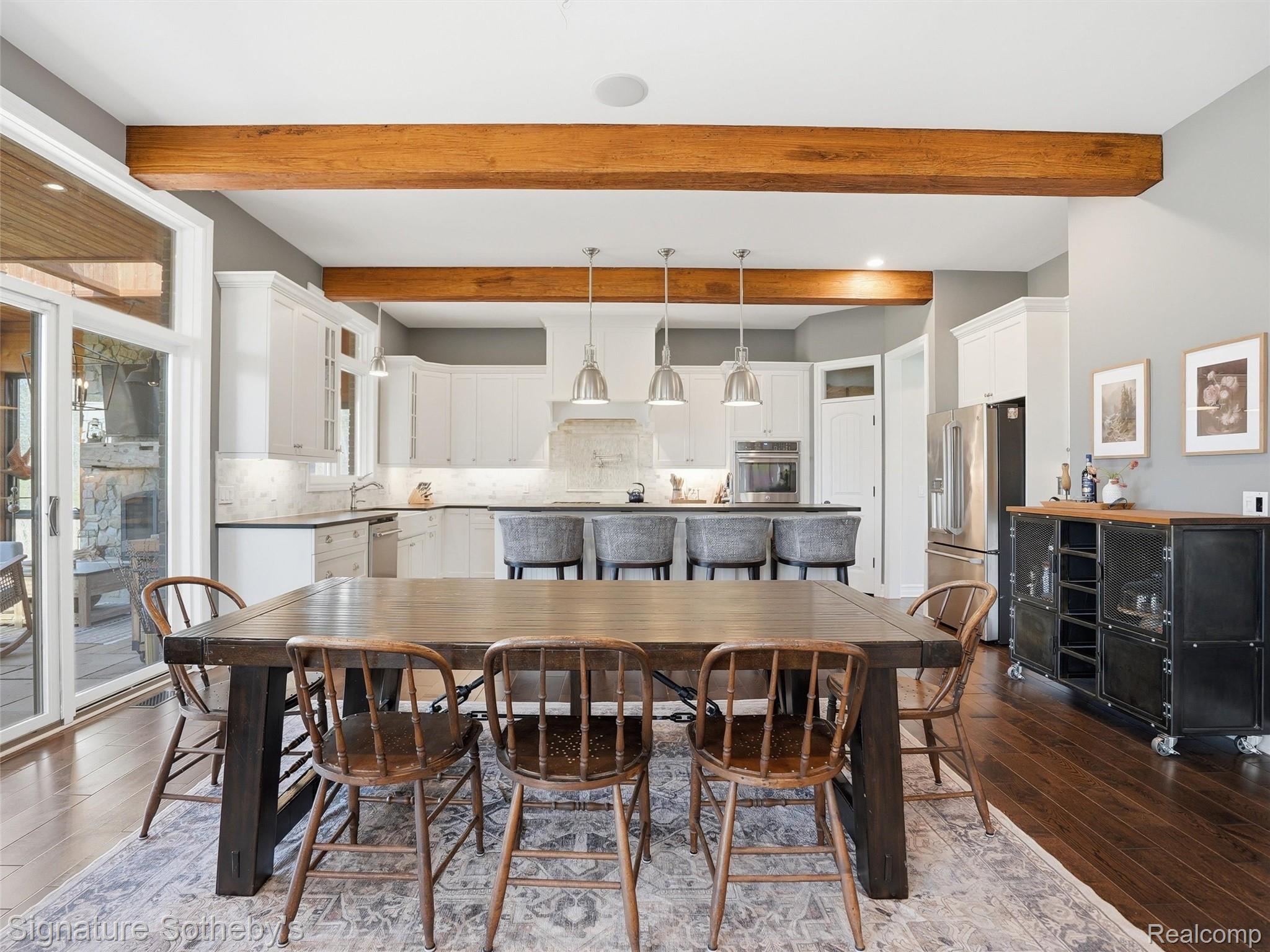 1595 Carriage Way Rochester, MI 48307 - Photo 30 of 78 Dining area featuring dark wood-style floors and beamed ceiling