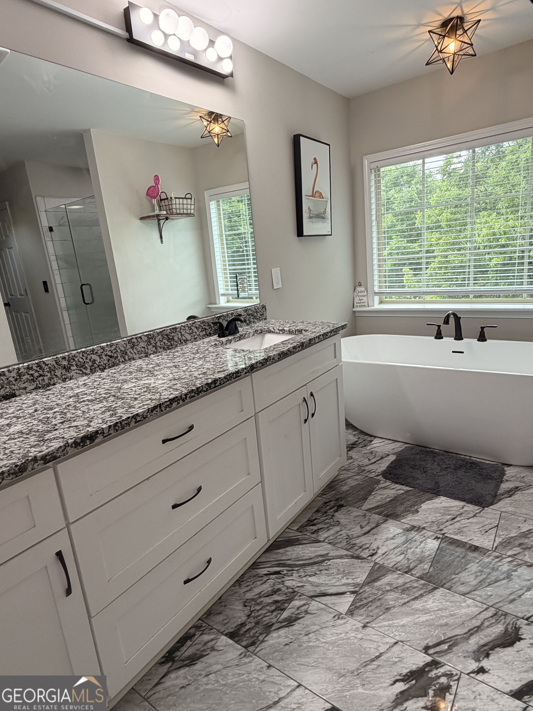 892 Perimeter Road Monticello, GA 31064 - Photo 25 of 38 a bathroom with a tub sink and mirror