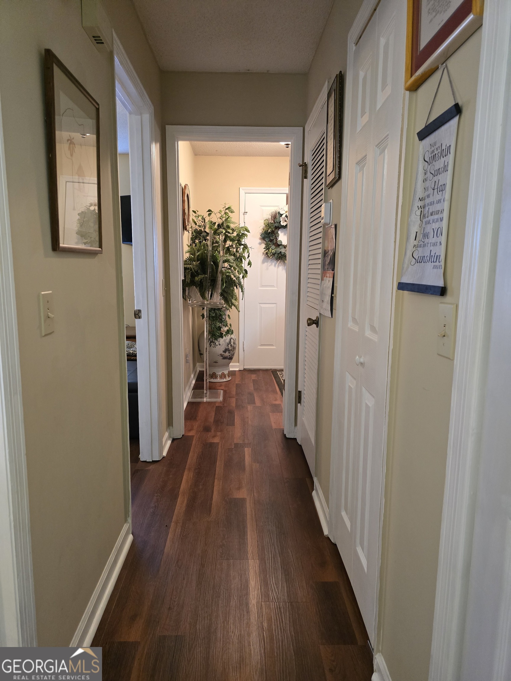 479 Mitchell Loop Bluffton, GA 39824 - Photo 35 of 51 a view of a hallway with wooden floor and staircase