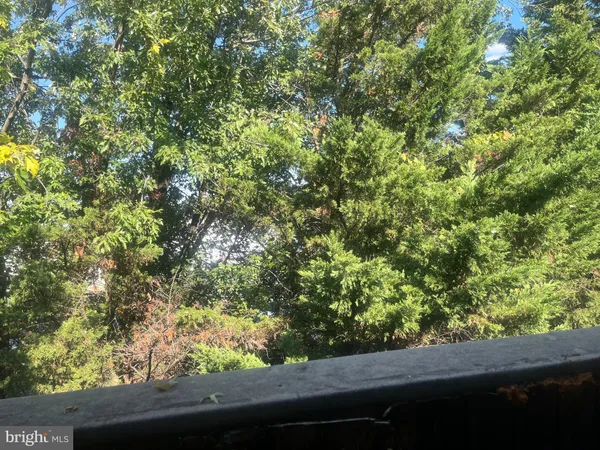 a view of a car park in front of a house