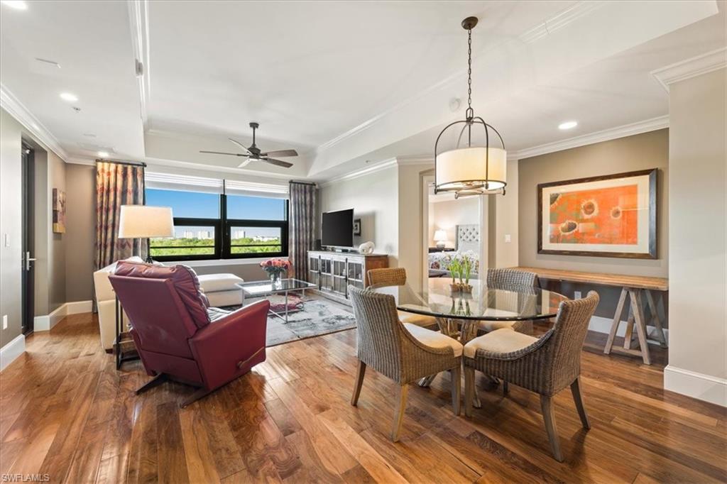 9115 Strada Place, Unit 5512 Naples, FL 34108 - Photo 1 of 42 a living room with furniture fireplace and a table