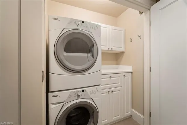 a view of a refrigerator in kitchen and wooden floor