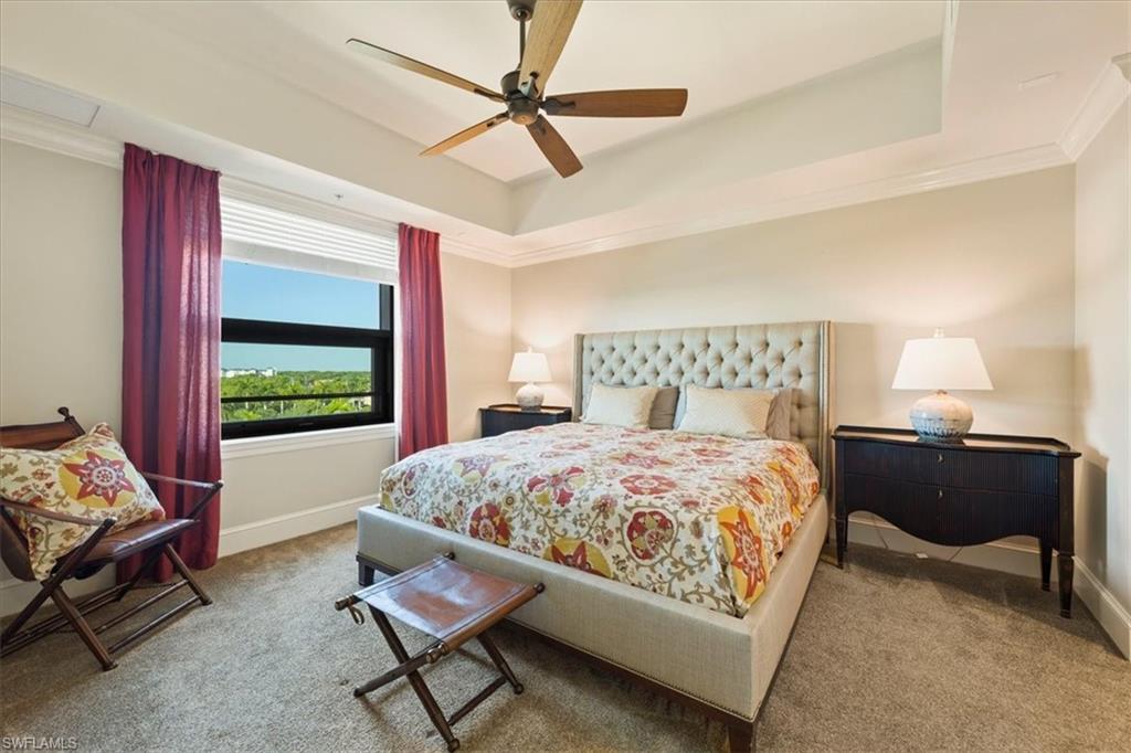 9115 Strada Place, Unit 5512 Naples, FL 34108 - Photo 14 of 42 a bedroom with a bed and a window
