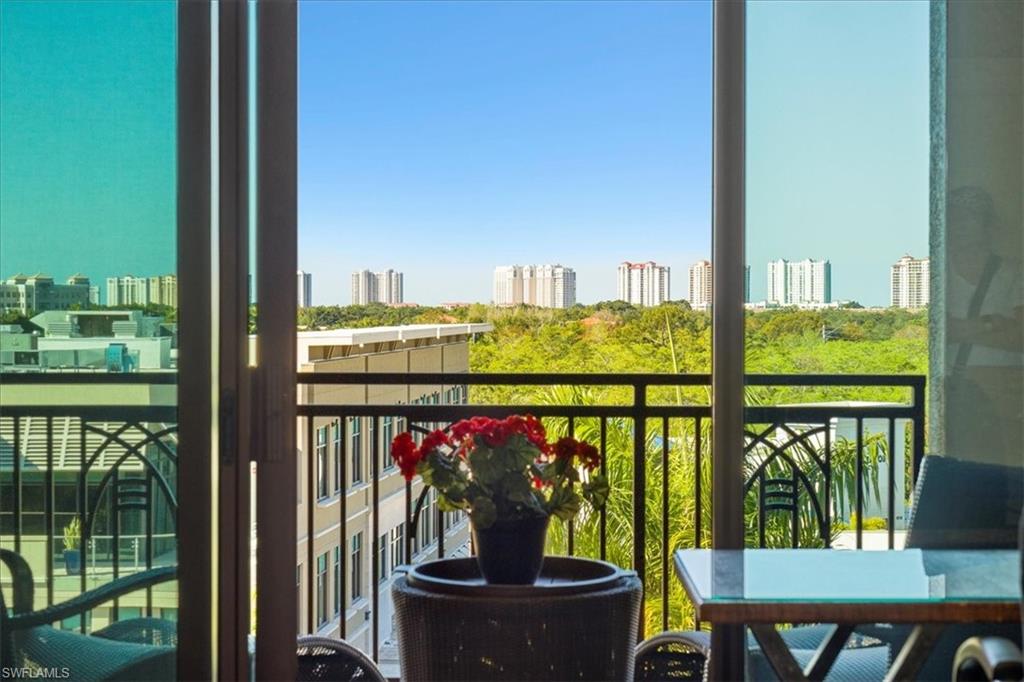 9115 Strada Place, Unit 5512 Naples, FL 34108 - Photo 22 of 42 a view of a balcony with chairs