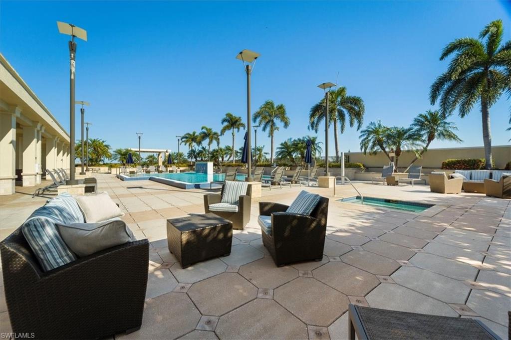 9115 Strada Place, Unit 5512 Naples, FL 34108 - Photo 31 of 42 a view of a patio with couches and chairs