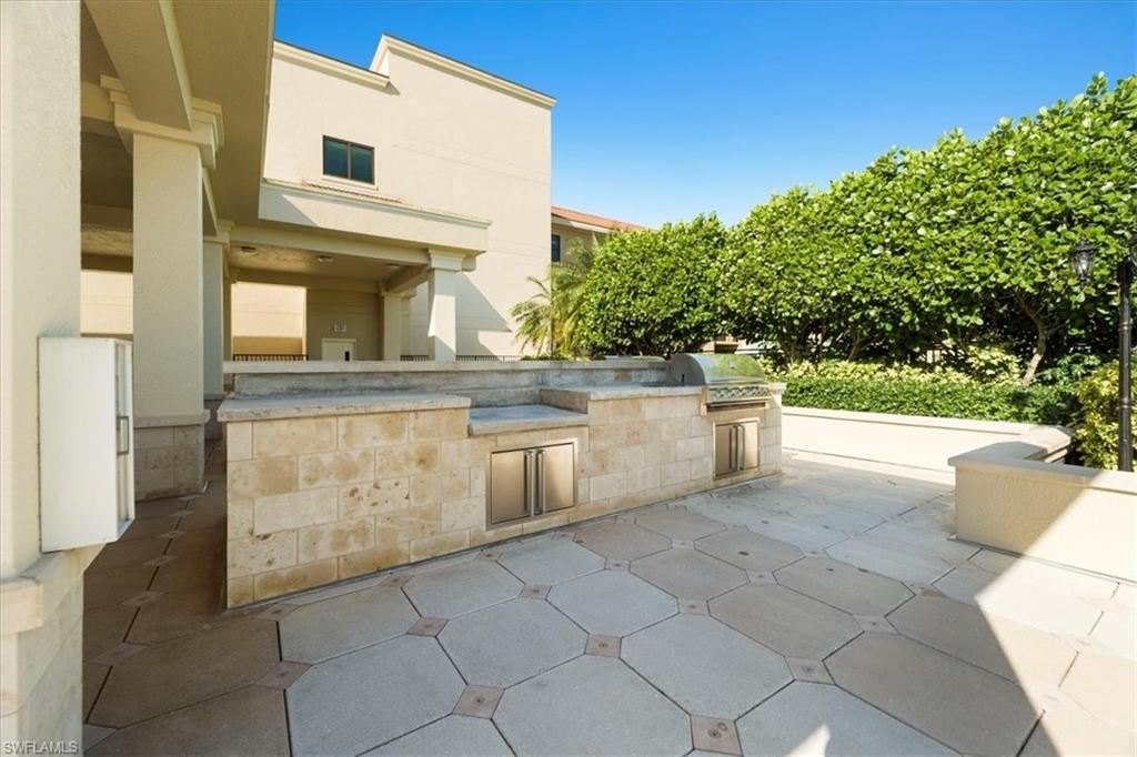 9115 Strada Place, Unit 5512 Naples, FL 34108 - Photo 33 of 42 a view of a back yard of the house