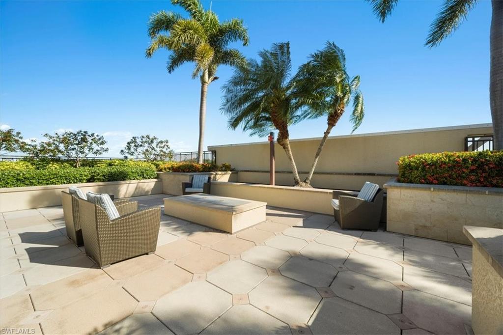 9115 Strada Place, Unit 5512 Naples, FL 34108 - Photo 34 of 42 a roof deck with couches and potted plants