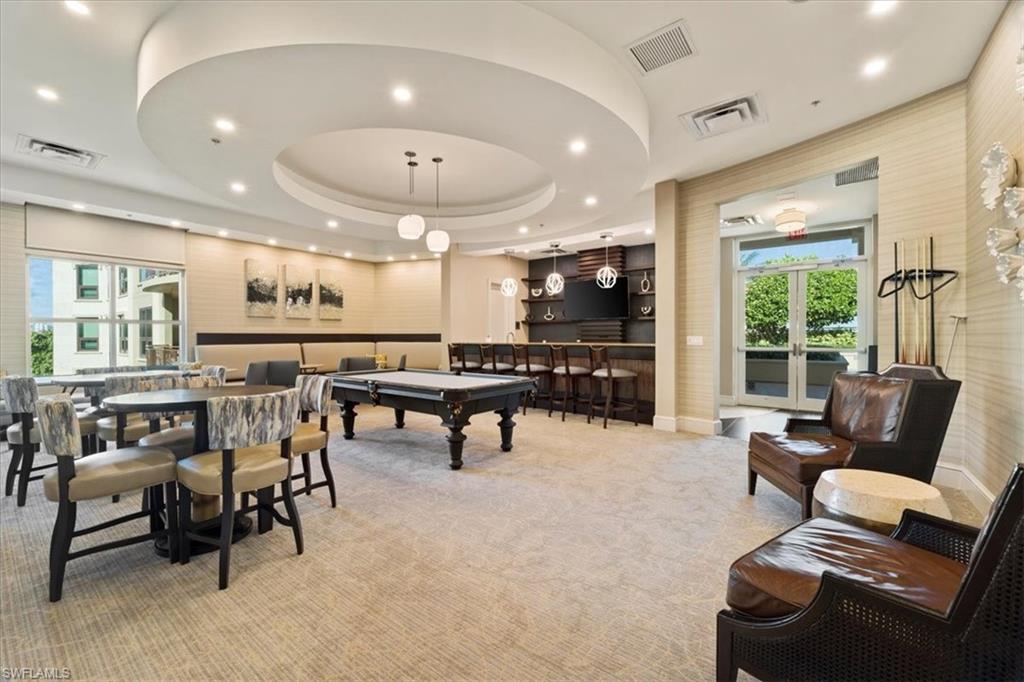9115 Strada Place, Unit 5512 Naples, FL 34108 - Photo 35 of 42 a living room with furniture and a large window