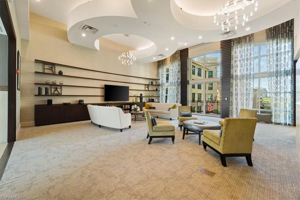 9115 Strada Place, Unit 5512 Naples, FL 34108 - Photo 36 of 42 a living room with furniture and a large window