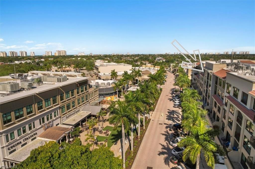 9115 Strada Place, Unit 5512 Naples, FL 34108 - Photo 38 of 42 a view of a lake with a city