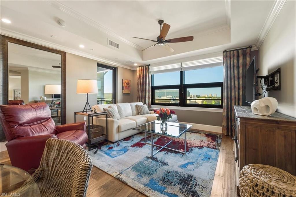 9115 Strada Place, Unit 5512 Naples, FL 34108 - Photo 5 of 42 a living room with furniture and a window
